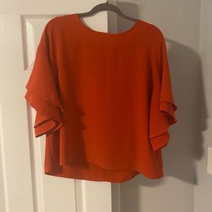 H&M short sleeve blouse. Oversized fit with ruffle sleeves. Size 12.